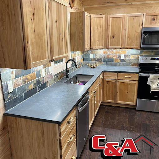 Warm wood kitchen cabinets with slate backsplash